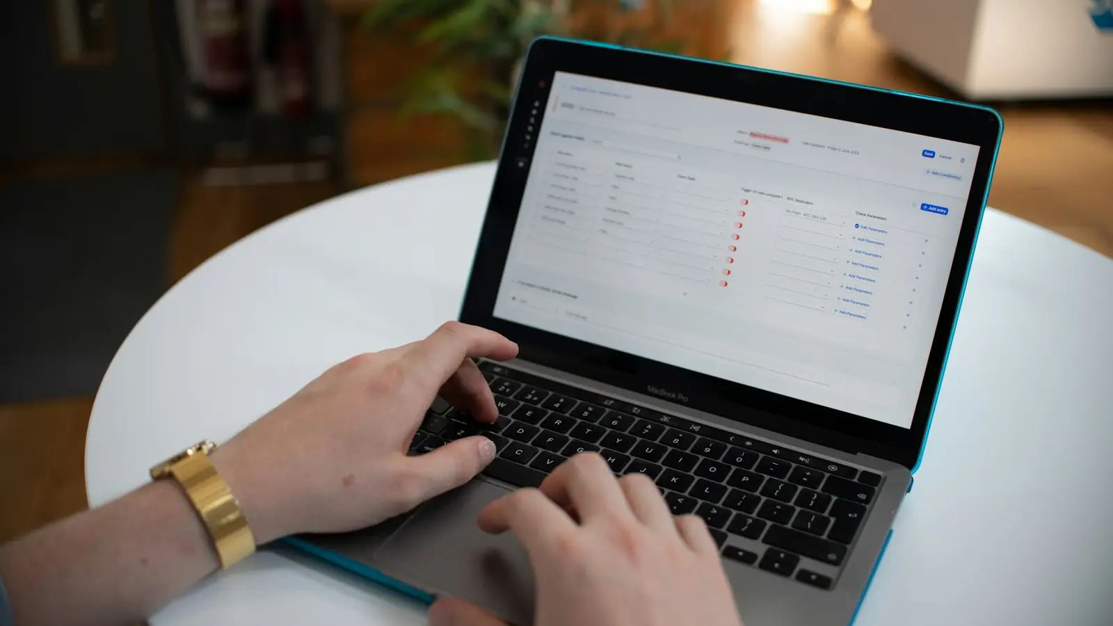 Hands typing on a laptop with a workflow tool open