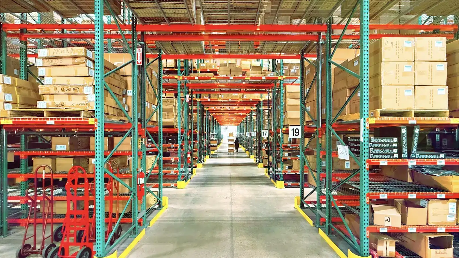 Aisles of stocked shelves in a fulfilment warehouse